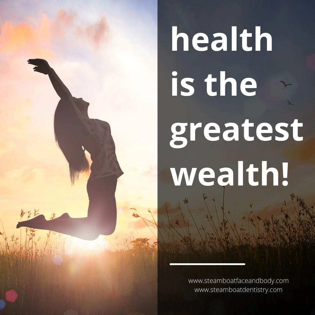 'Health is the greatest wealth' next to a woman jumping in the air in a field